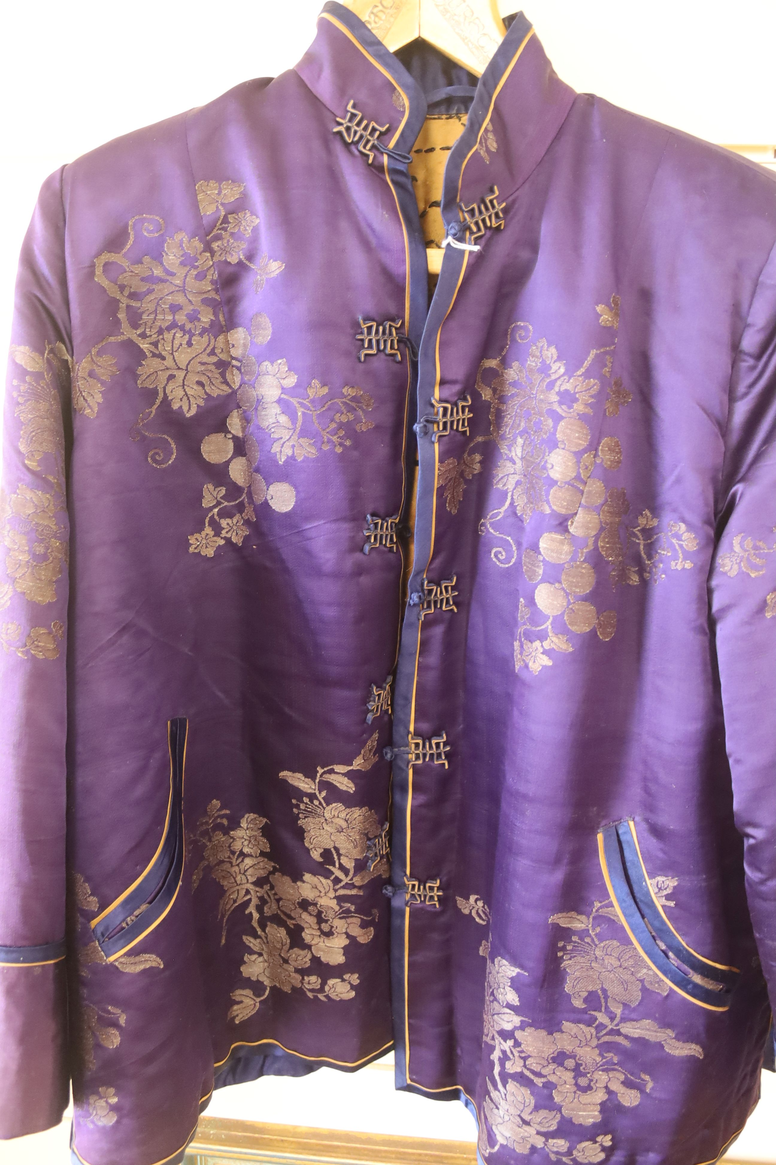 A Chinese purple brocade silk quilted jacket, length 71cm